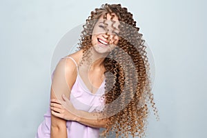 Portrait of beautiful young woman with shiny wavy hair