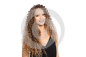 Portrait of beautiful young woman with shiny wavy hair