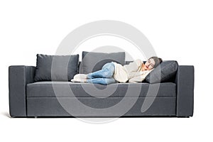 Portrait of beautiful young woman sleeping on couch