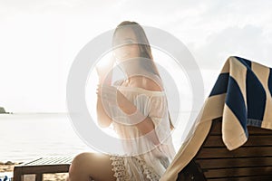 Portrait of a beautiful young woman smiling while enjoying a cocktail