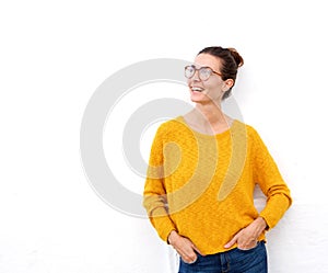 Beautiful young woman smiling with glasses on white background