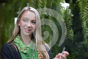 Portrait of a beautiful young woman smoking