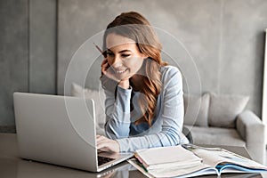 Portrait of a beautiful young woman studying