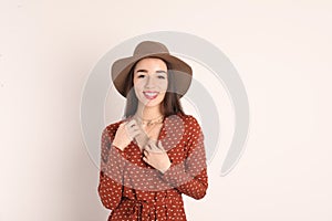 Portrait of beautiful young woman in stylish dress