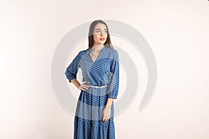 Portrait of beautiful young woman in stylish dress