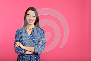 Portrait of beautiful young woman in stylish dress on color background.