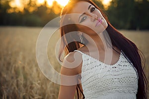 Portrait beautiful young woman at sunset