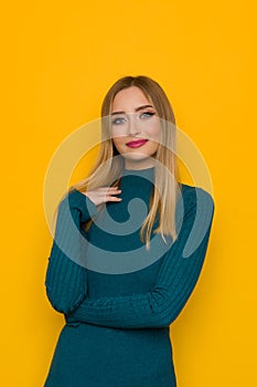 Portrait Of Beautiful Young Woman In Teal Fitted Dress