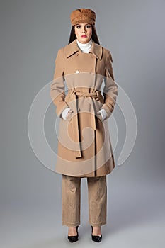 Portrait of beautiful young woman wearing a coat