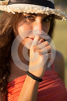 Portrait of beautiful young woman wearing hat, seductive.