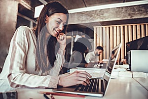 Portrait of beautiful young woman working in the office