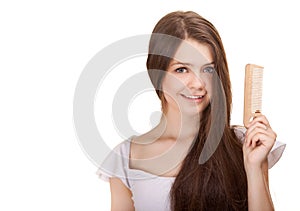 Portrait of a beautiful youth teen girl with comb