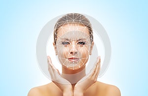 Portrait of beautifyl woman with a scanning grid. Face id, security, facial recognition, authentication technology.