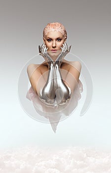 Portrait of beauty cyber woman from the future with clay hairstyle and silver hands