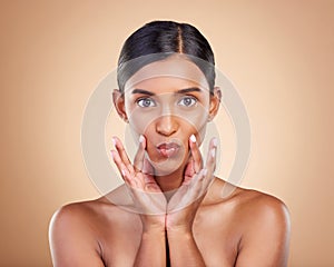 Portrait, beauty and pout a model woman in studio on a beige background for natural skincare. Face, lips and kiss with