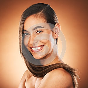 Portrait, beauty and woman smile, skincare and healthy hair care, happy and cosmetics in brown studio background. Young