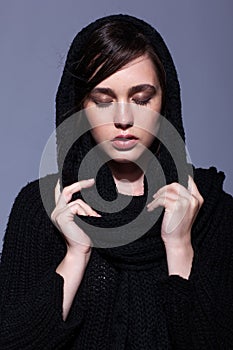 Portrait of beauty young brunette woman portrait in black fashion female pullover