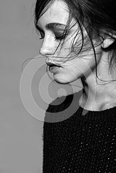 Portrait of beauty young brunette woman portrait in black fashion female pullover