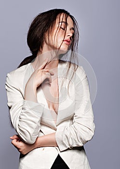 Portrait of beauty young brunette woman portrait in white fashion female jacket