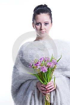 Portrait of beauty young woman with bunch of spring flowers