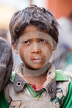 Portrait beggar young boy on the street in Leh, Ladakh. India