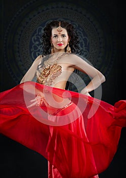 Portrait of belly dancer in red costume