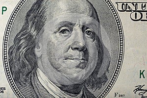 Portrait of Ben Franklin on the US 100 dollar bill in macro. Benjamin Franklin on hundred dollar American banknote