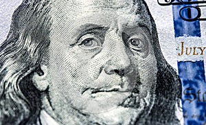 Portrait of Benjamin Franklin on one hundred dollars banknote