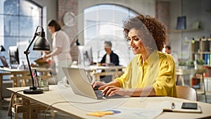 Portrait of Biracial Productive Young Woman Working on Computer in Modern Busy Office. Female Team