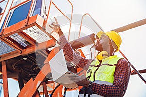 Portrait Black African staff worker happy smile working in cargo crane shipping logistic port