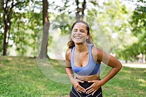 Portrait of black beautiful woman laughing and funny after break workout at park,Happy and smiling,Relaxing time