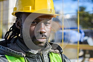 portrait of black man engineer supervisor looking at camera at construction site