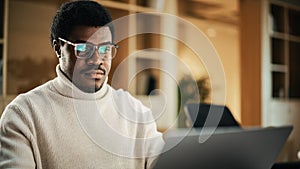 Portrait of Black Productive Young Man Working on Laptop in a Cotemporary Office. Businessman