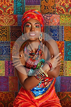 Portrait of a Black Woman against the background of a traditional African carpet