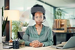 Portrait, black woman and serious in call center for business, customer service or telemarketing in office. Contact us