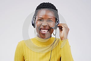 Portrait, black woman and smile with headset in studio on white background for consultant, call centre or crm. Female
