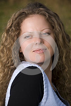 Portrait of a blond curly girl