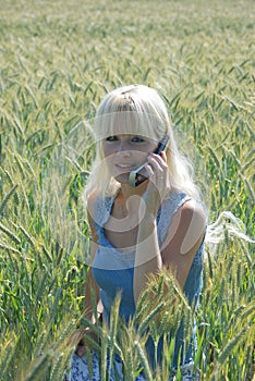 Portrait of blond woman phoning