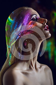 Portrait of blond Woman with shining lights on face
