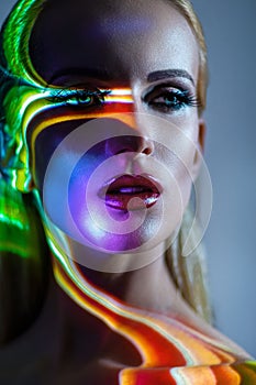 Portrait of blond Woman with shining lights on face