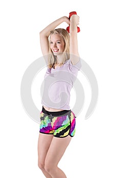 Portrait of a blond woman in sportswear training hands, shoulders and back with the dumbbells