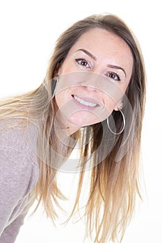 Portrait of blonde beautiful young woman long hairs looking at camera happy smiling isolated on white background