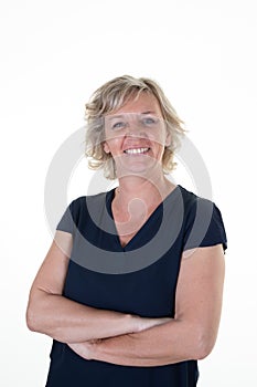 Portrait blonde caucasian senior woman smiling happy standing on white background with folded arms crossed