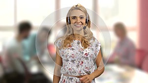 Portrait of a blonde female customer support operator.
