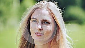 Portrait of a blonde girl of Slavic appearance. Close-up face.