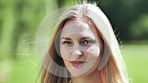 Portrait of a blonde girl of Slavic appearance. Close-up face.