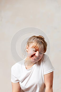 Portrait of  blonde girl in  white T-shirt