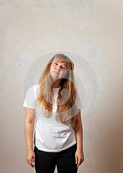 Portrait of  blonde girl in  white T-shirt