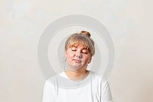 Portrait of  blonde girl in  white T-shirt