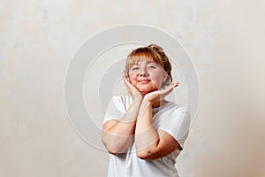 Portrait of  blonde girl in  white T-shirt